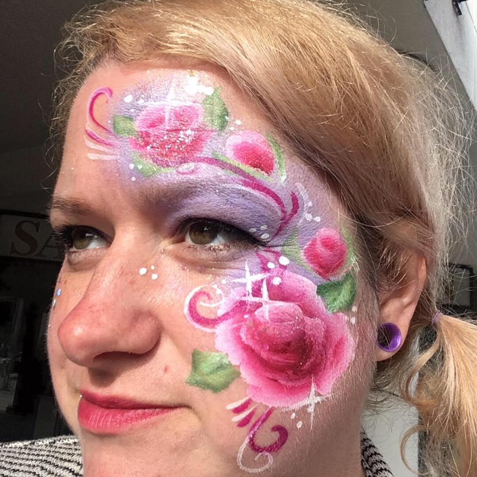 Adult with elegant floral face painting design